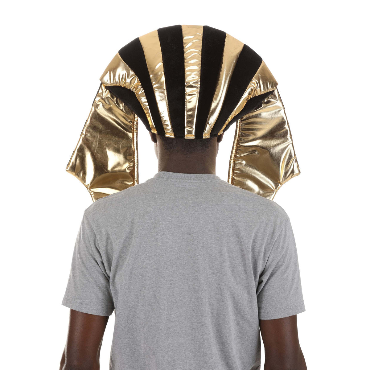 A person viewed from the back wearing a shiny gold and black striped pharaoh-style headdress costume against a plain white background.