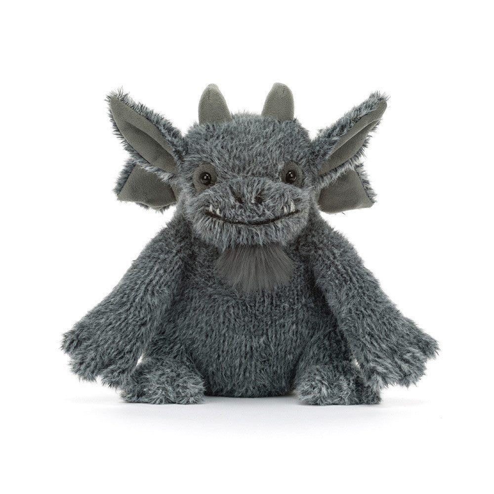 A gray plush gargoyle toy with large pointed ears, small horns, and a stitched smiling face, photographed against a clean white background.