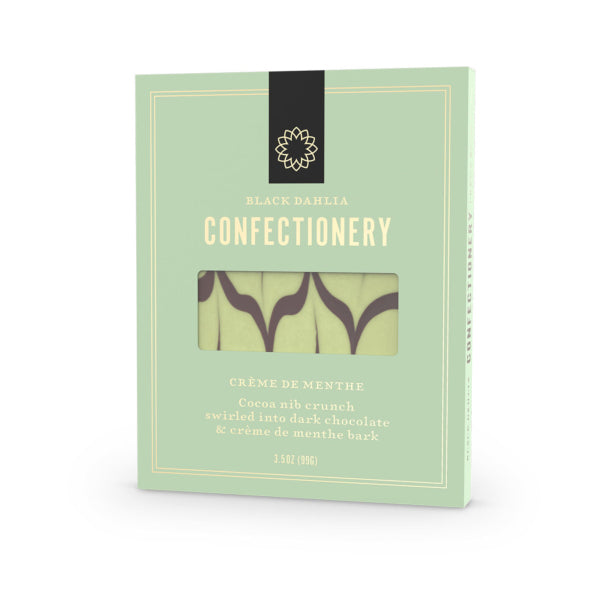 Green packaging of Black Dahlia Confectionery with a window showing chocolate bars.