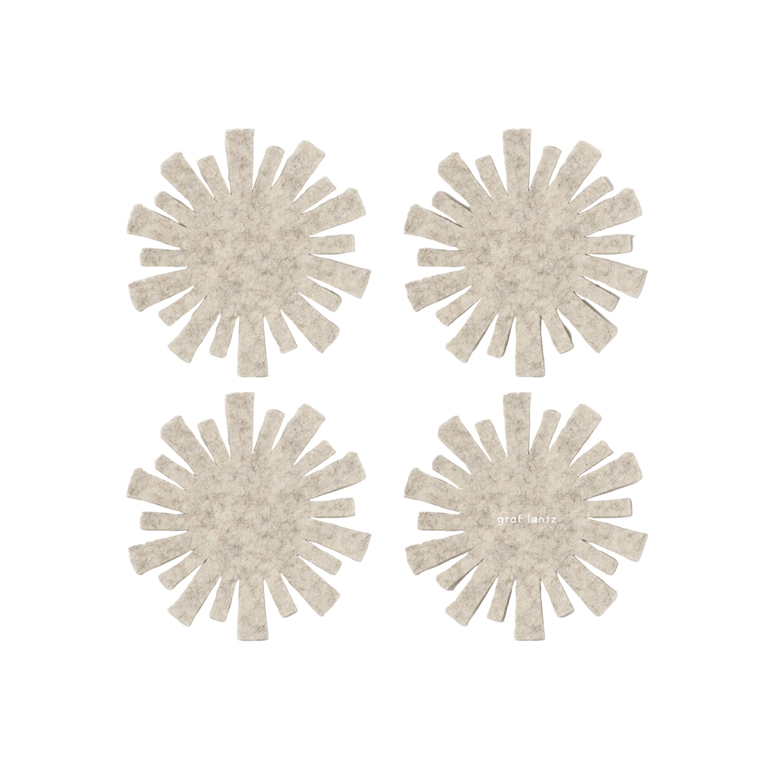 Four beige sunflower-shaped coasters on a white background