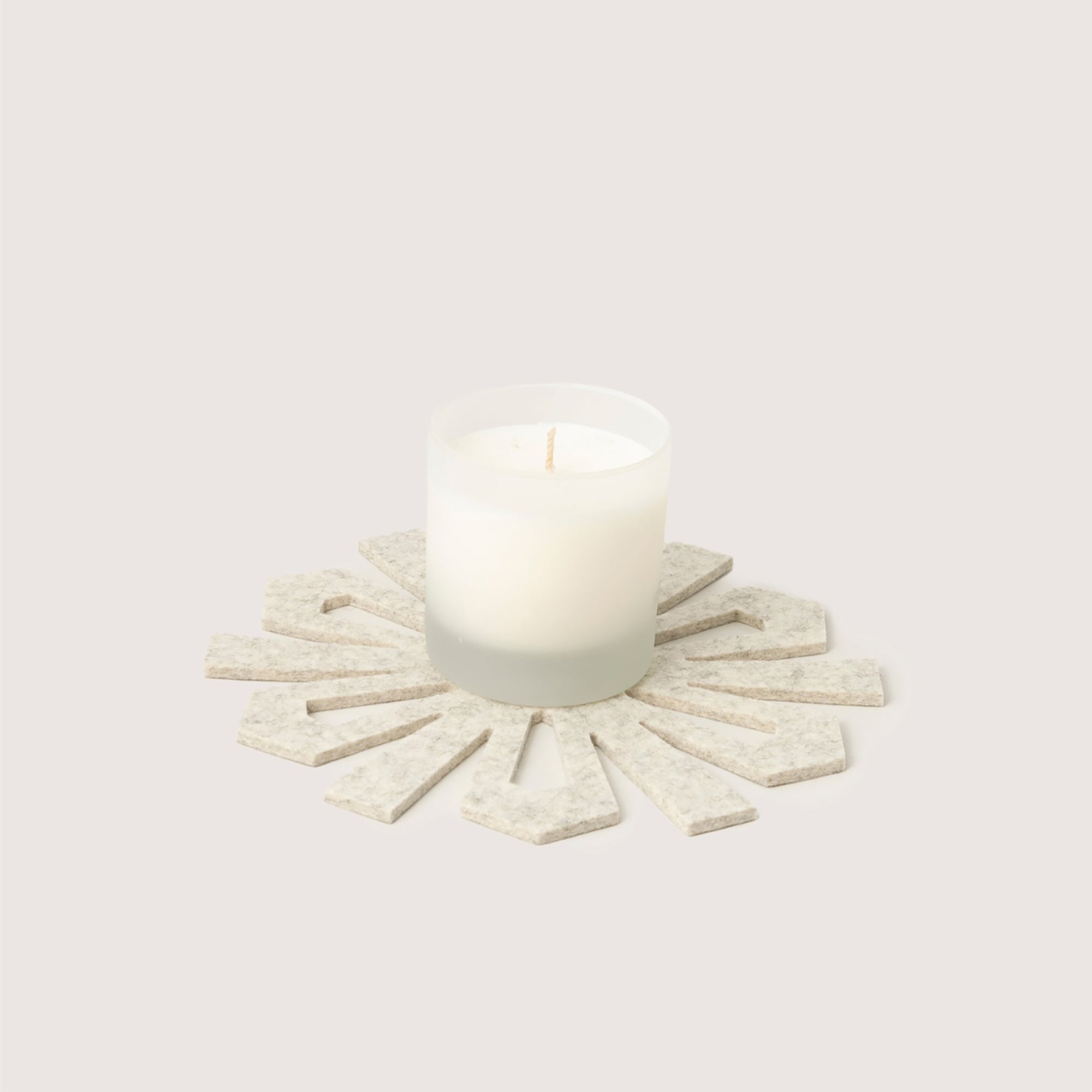 Decorative wall art with a sunburst design on a white background