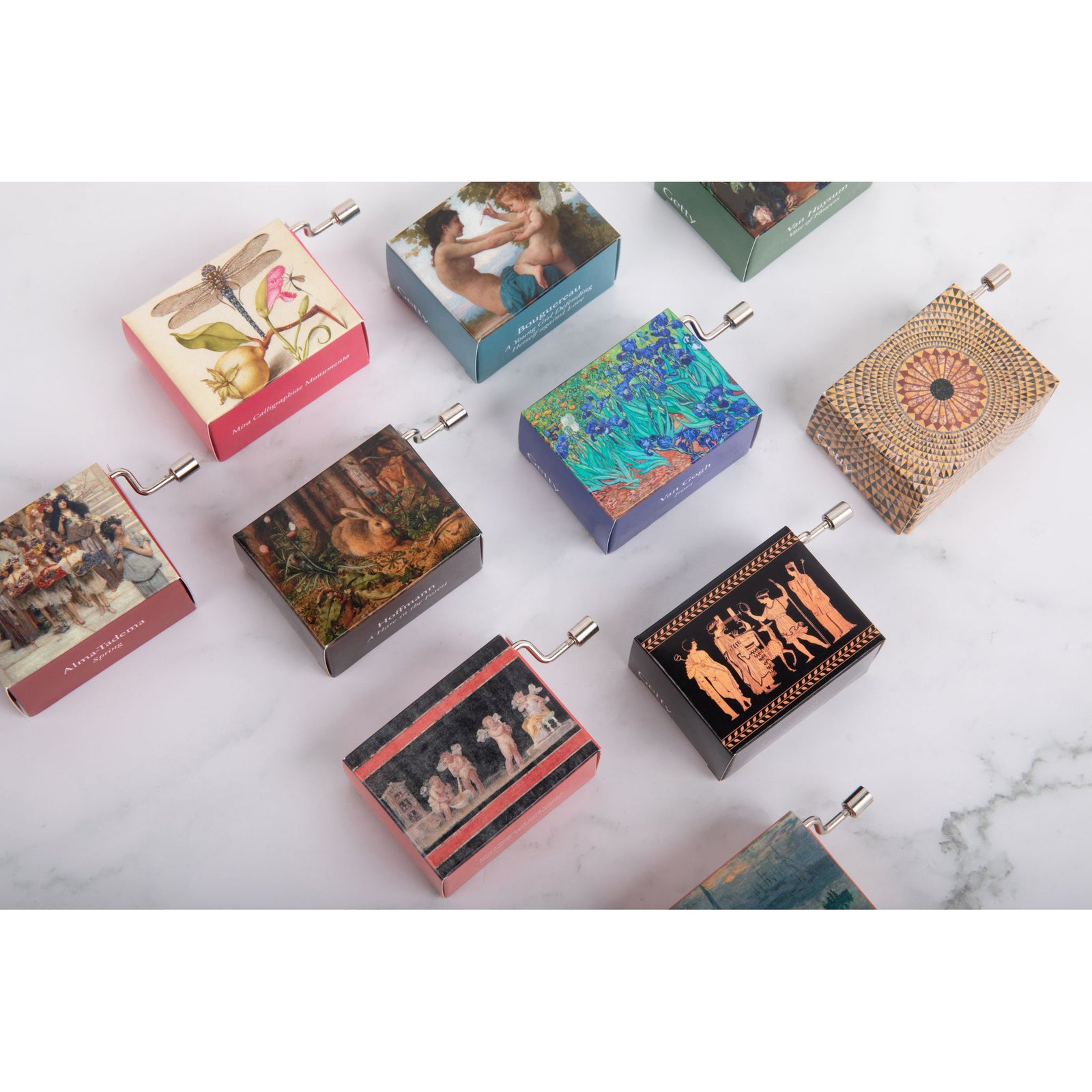 A music box with a detail from Lawrence Alma-Tadema's painting 'Spring' printed on it, featuring a scene of women and children carrying flowers.