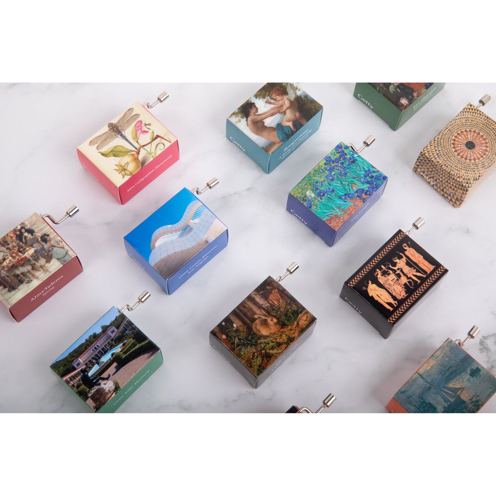 A music box with a print of Claude Monet's painting 'Sunrise (Marine)' depicting a port scene with boats and the sun rising over the water.