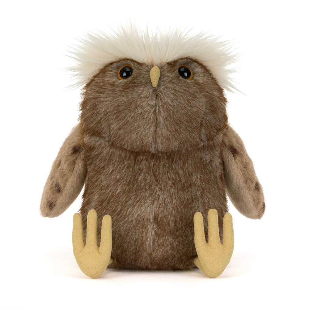 A brown plush owl toy with fluffy white feathers on its head, yellow eyes, a small yellow beak, and pale yellow feet, photographed against a plain white background.