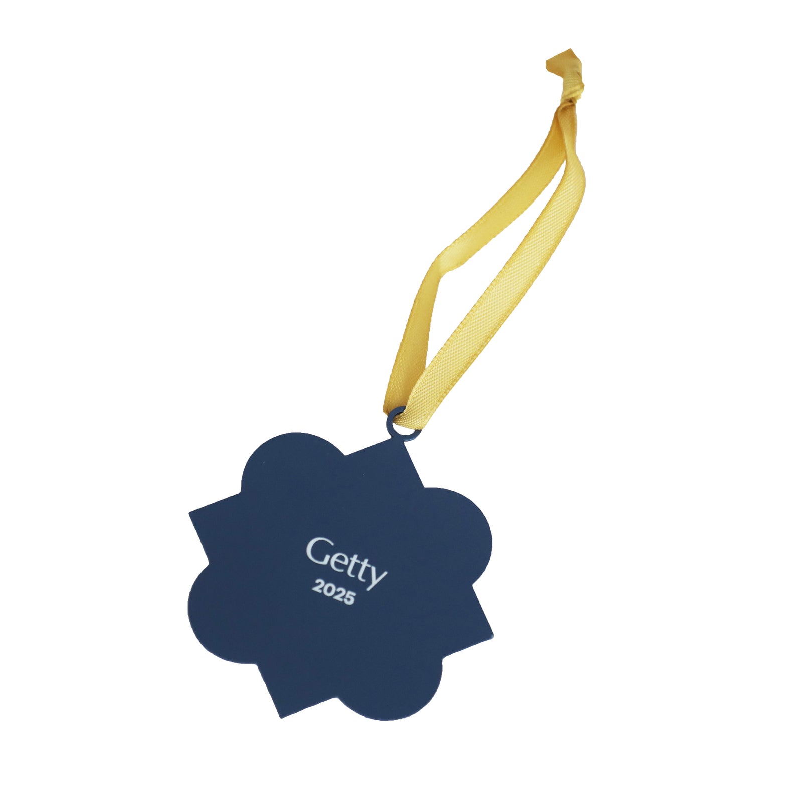 Decorative blue and gold ornament with a ribbon on a white background