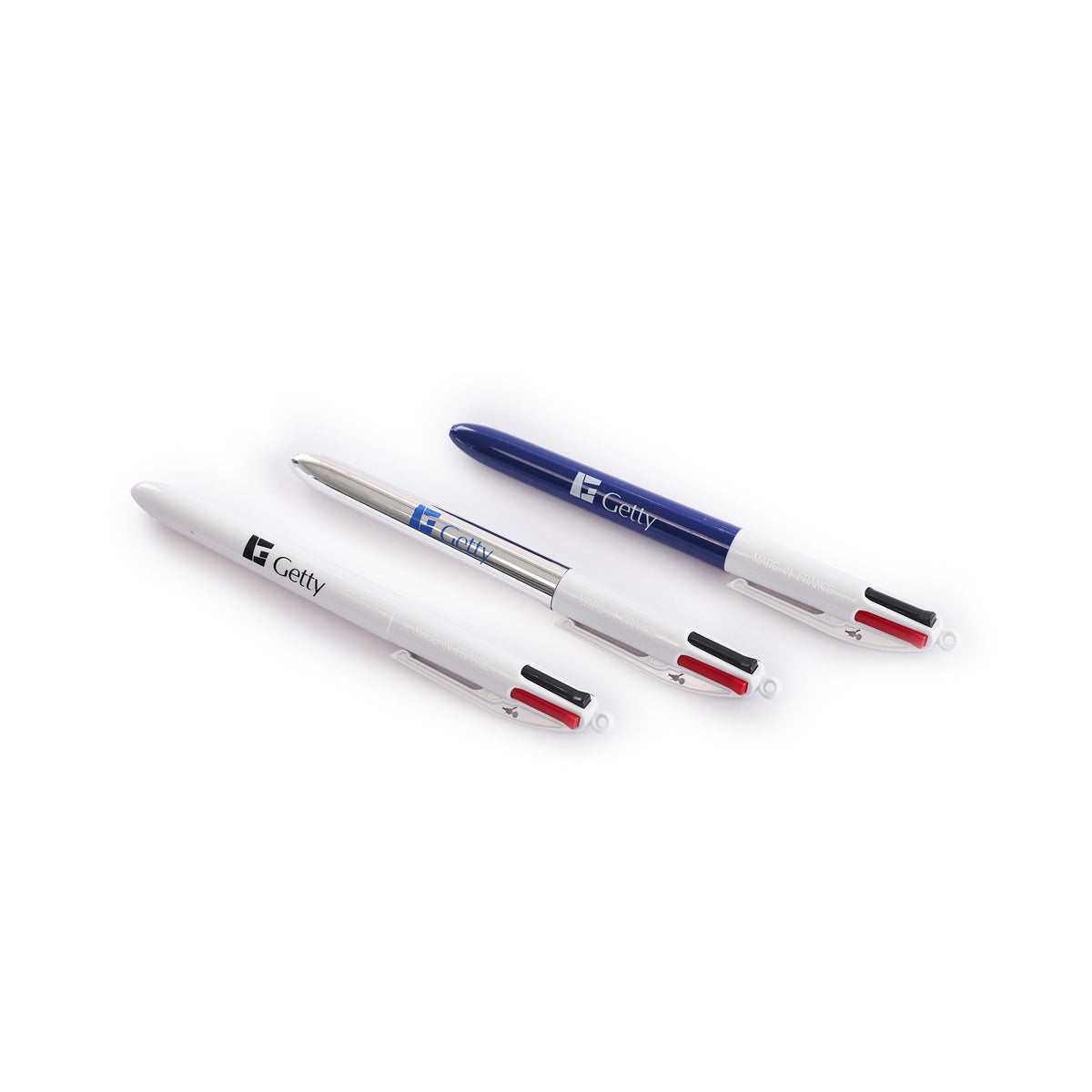 Three multi-color ballpoint pens with the brand name 'Getty' printed on them, arranged diagonally on a clean white background.