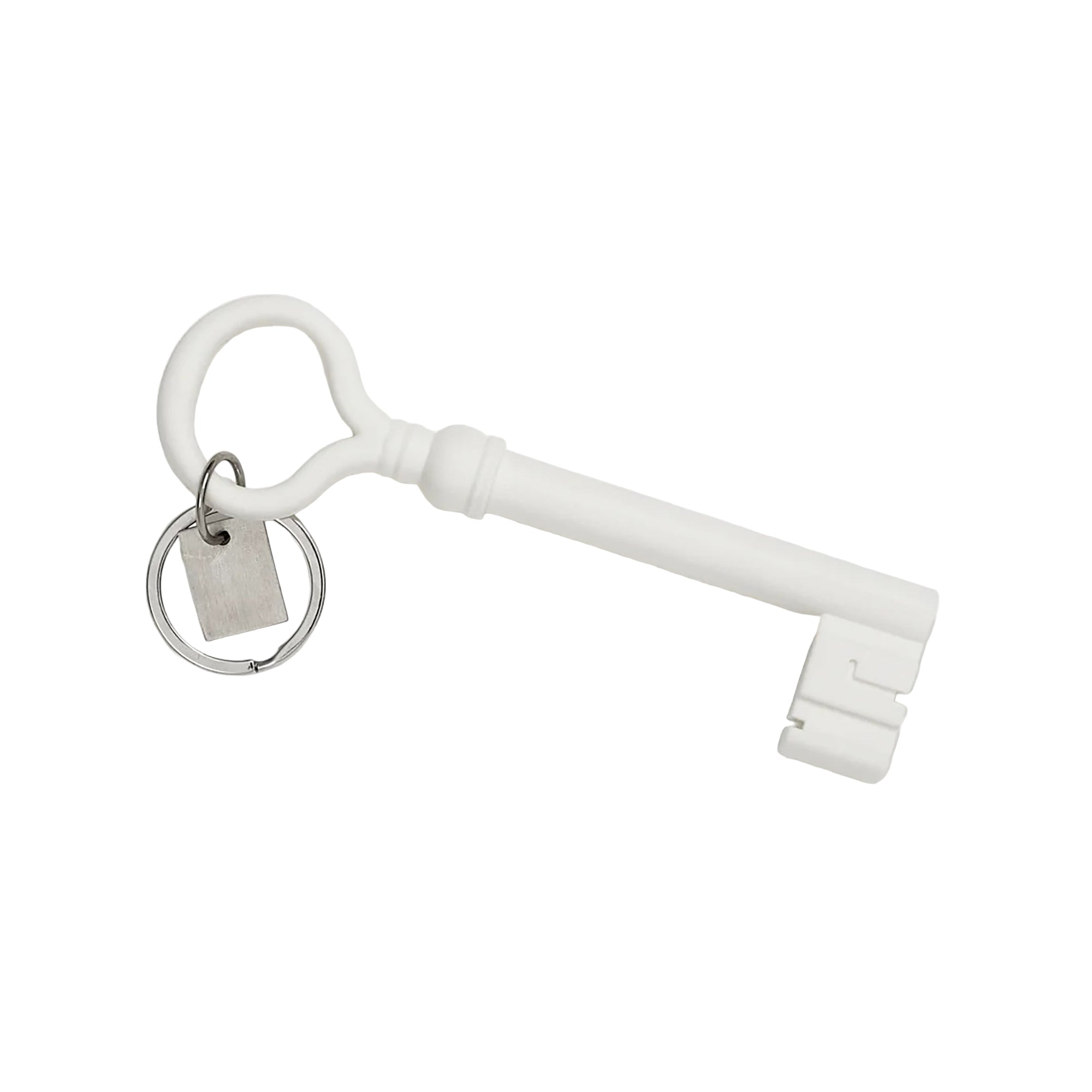 White key-shaped keychain with a small round tag on a white background