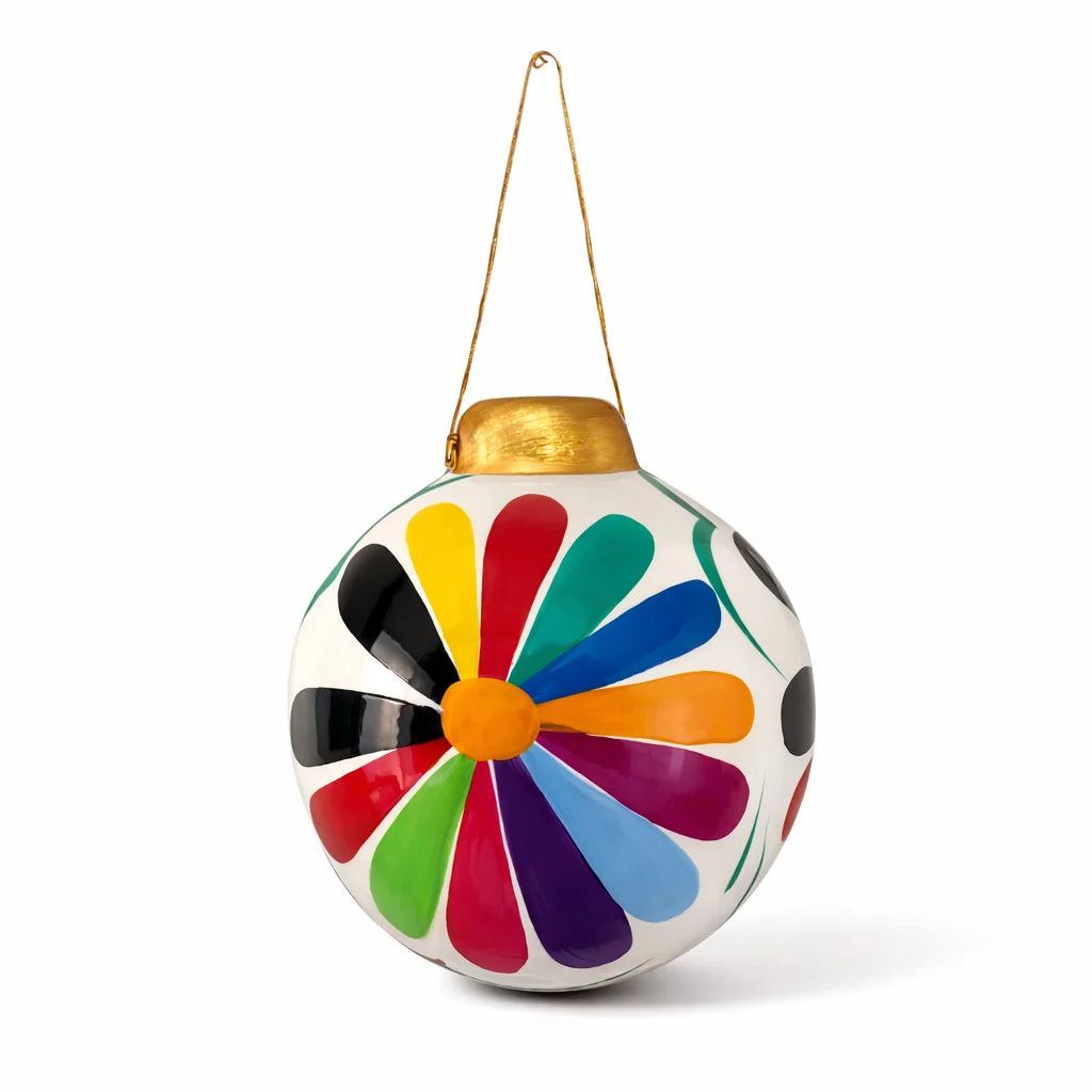 Colorful spherical hanging ornament with a gold hook on a white background