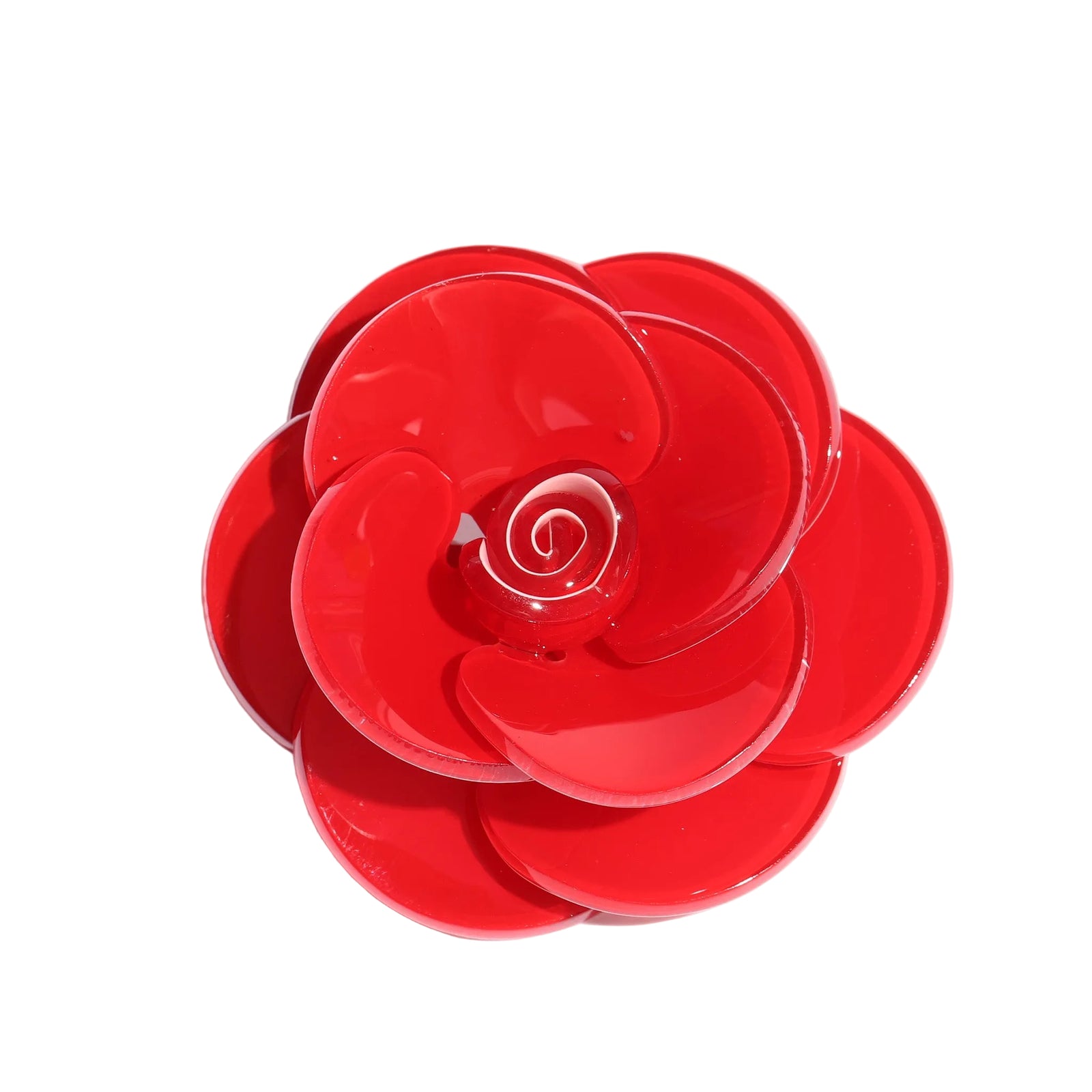 Red flower-shaped object on a white background
