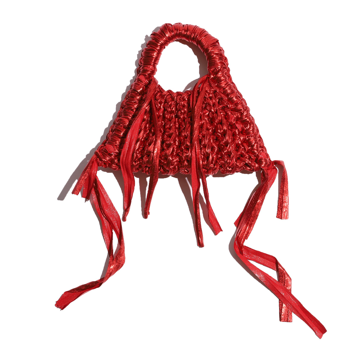 Red woven handbag with fringes on a white background