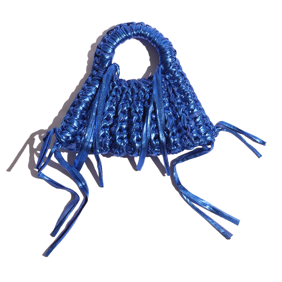 Blue woven handbag with tassels on a white background