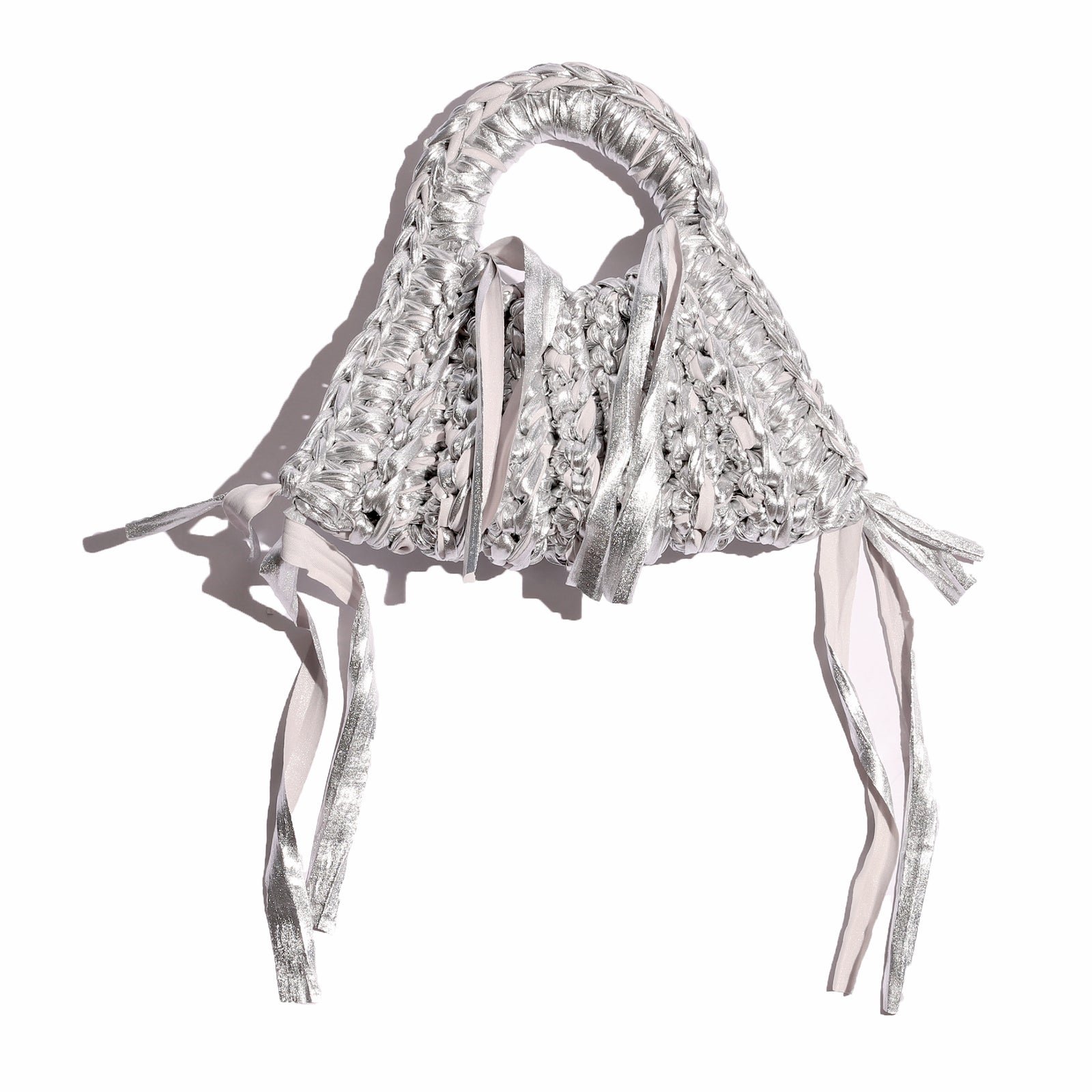 Red woven handbag with fringes on a white background