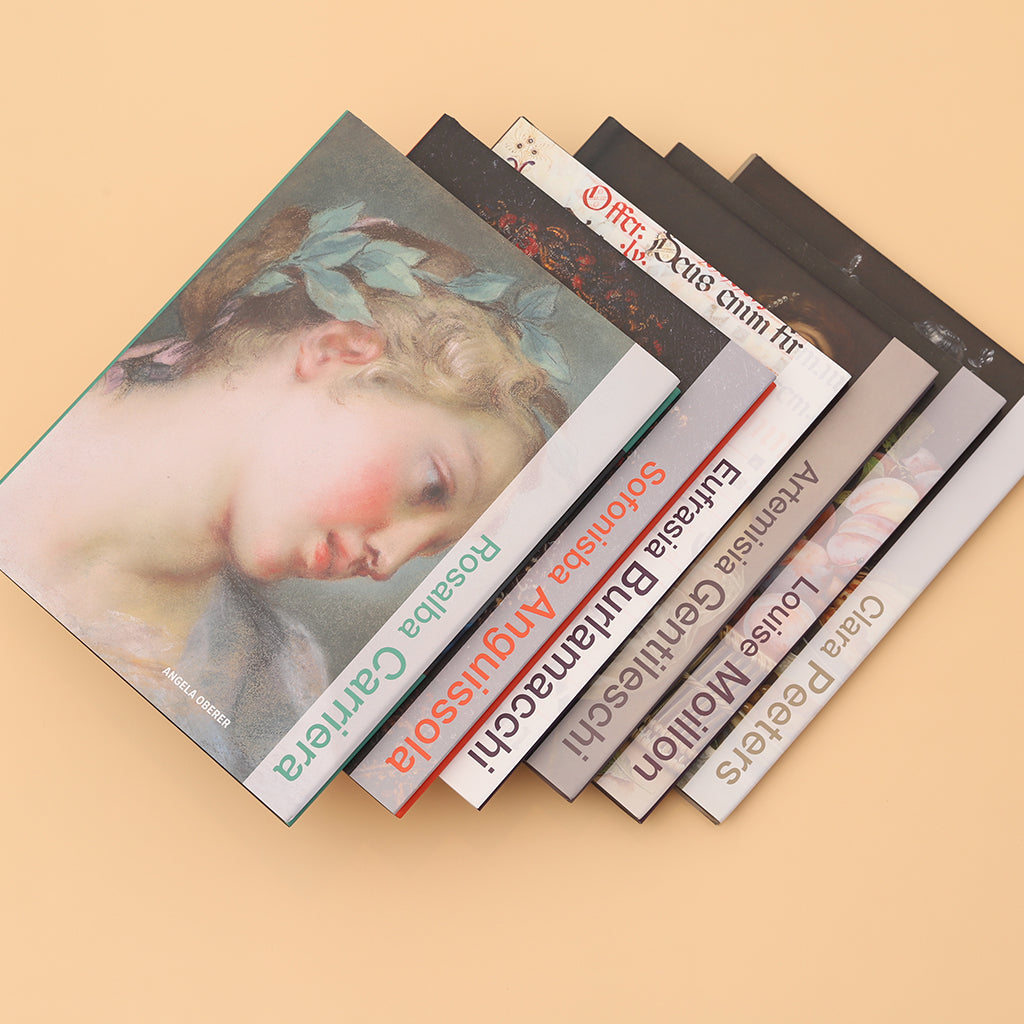 Stack of books with artistic covers on a beige background