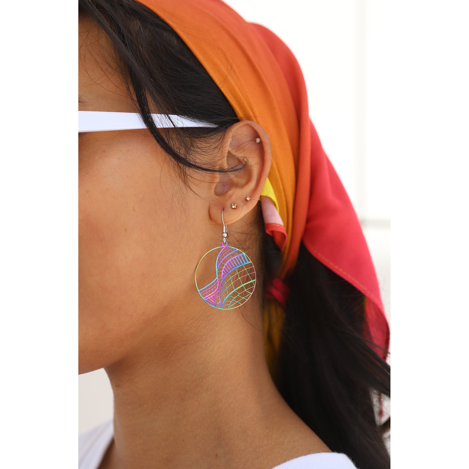 Colorful geometric earrings on a white background