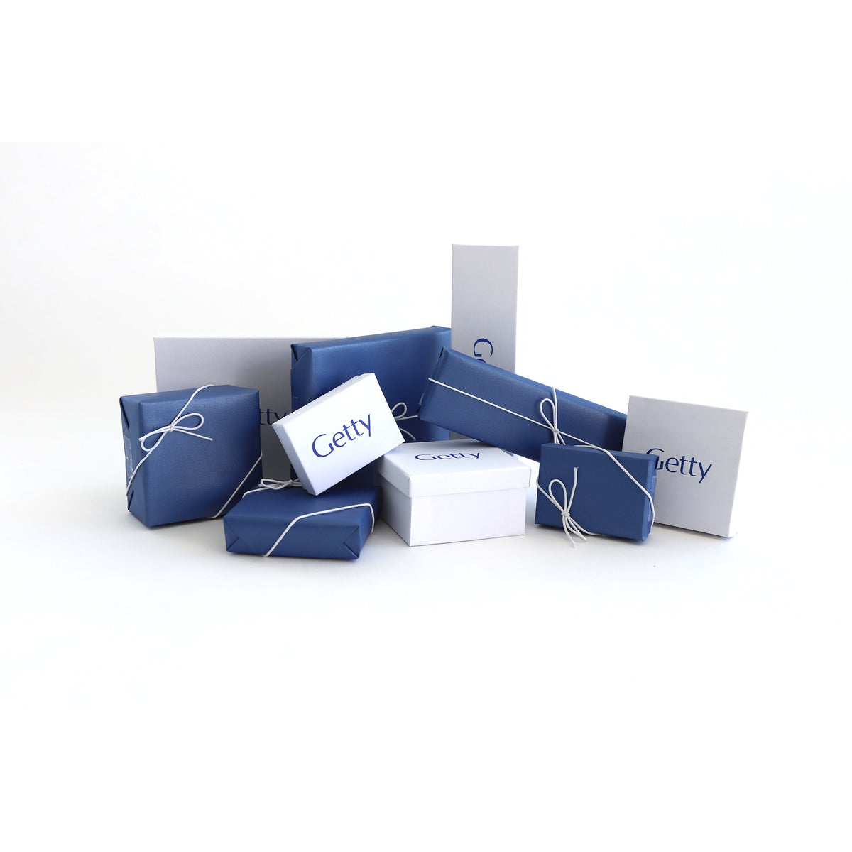 Collection of blue and white gift boxes with 'Getty' branding on a white background