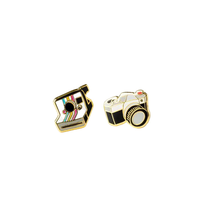 Two camera-shaped pins on a white background