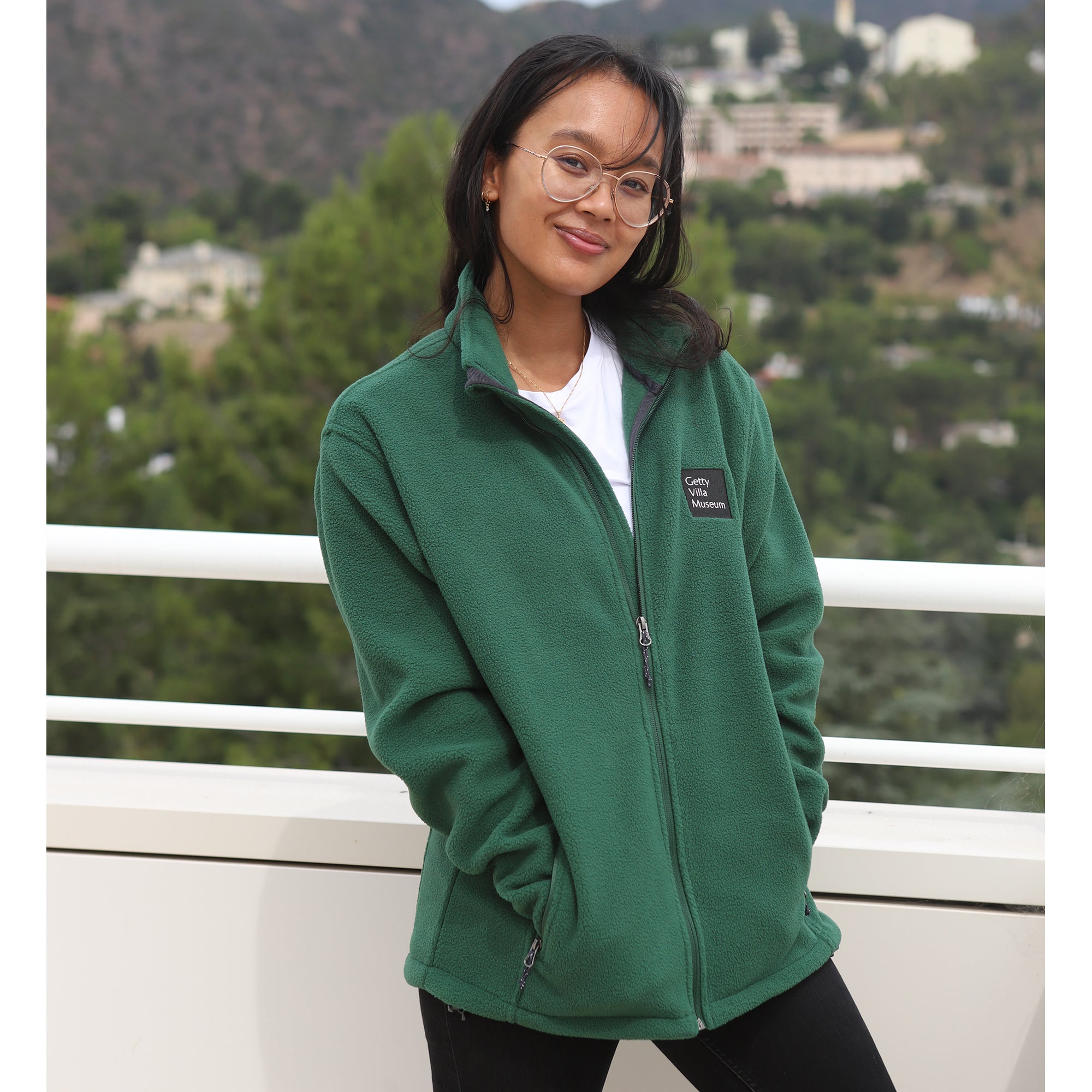 Green fleece jacket with a brand logo on a white background