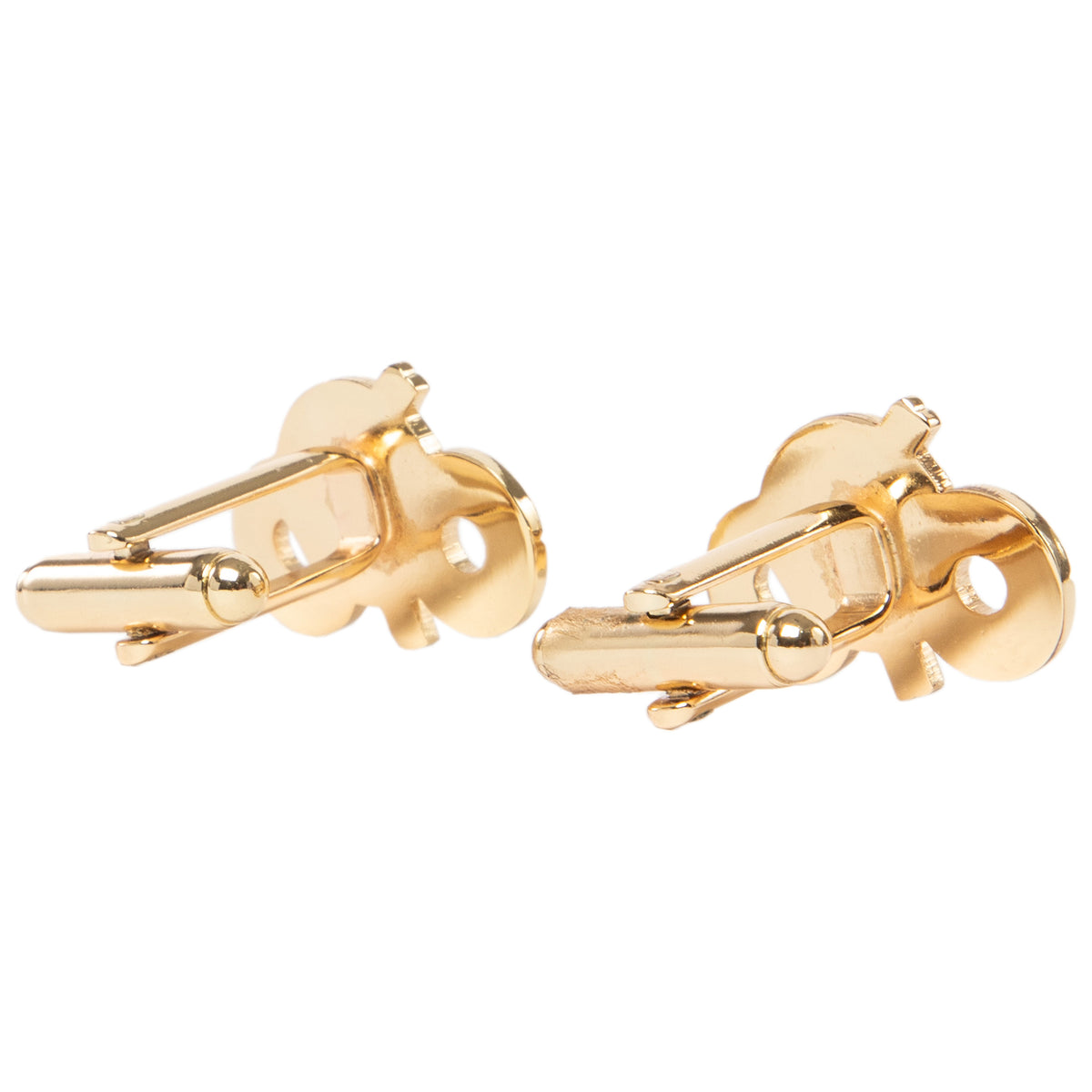 Gold motorcycle-shaped cufflinks on a white background