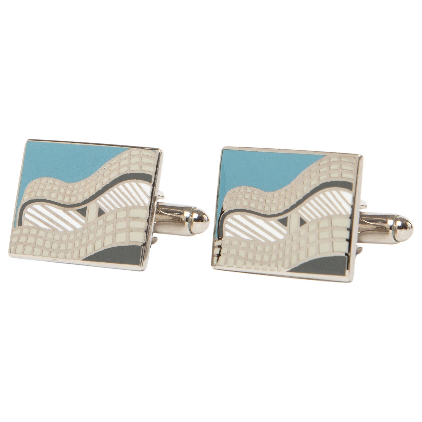 Pair of cufflinks with blue and silver design on a white background
