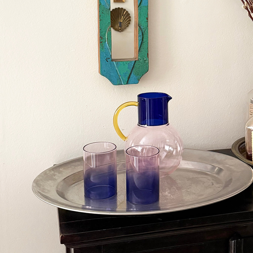 Glass and Pitcher on a Metal Tray
