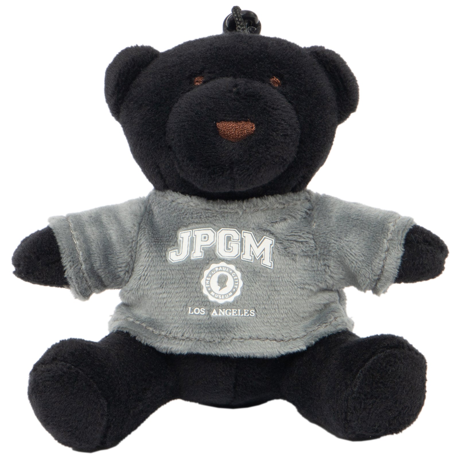 A plush black teddy bear wearing a grey sweatshirt with 'JPGM LOS ANGELES' printed on it.