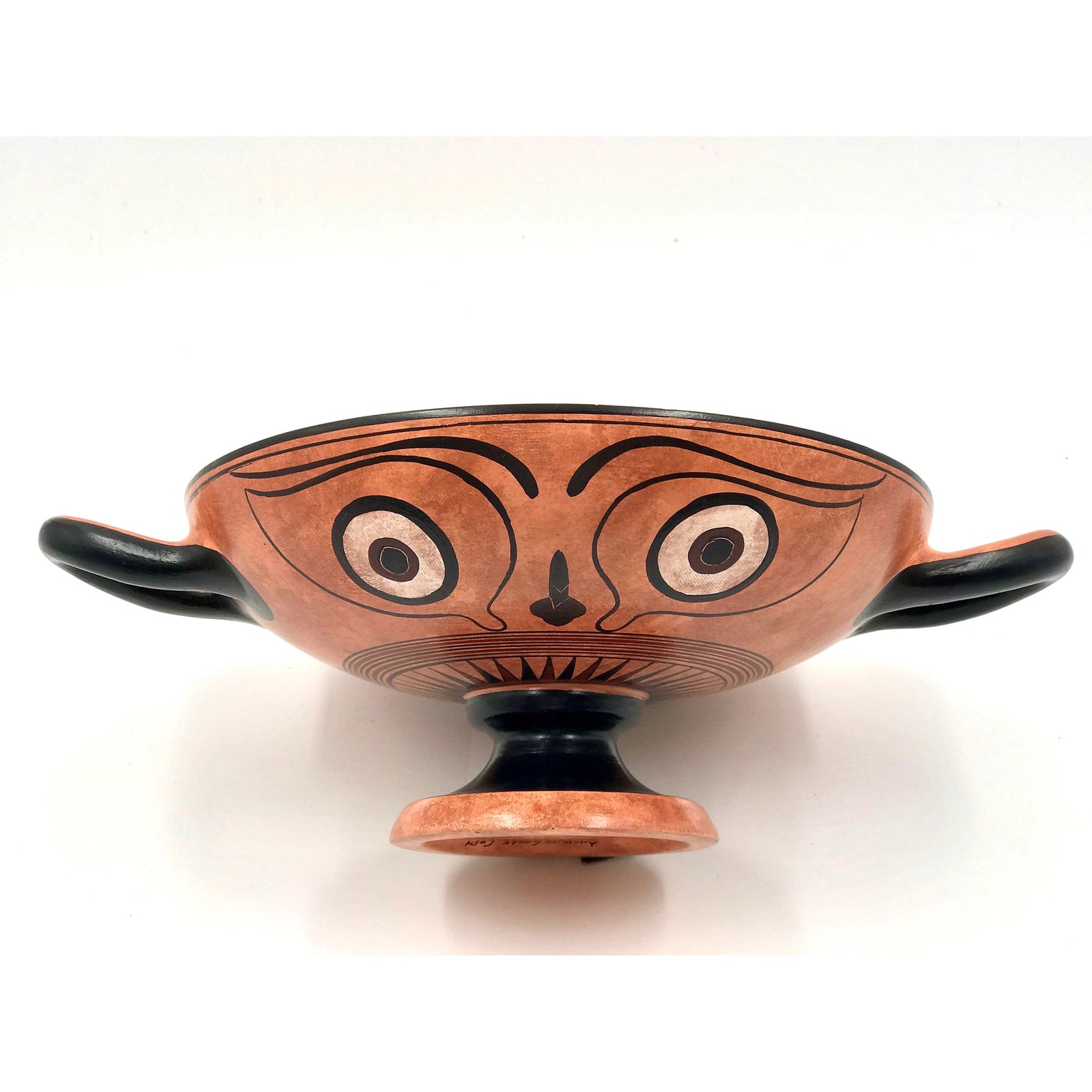 A hand-painted terracotta kylix cup featuring a depiction of Dionysos seated in his boat with surrounding dolphin-like figures, created in a classical Greek style.