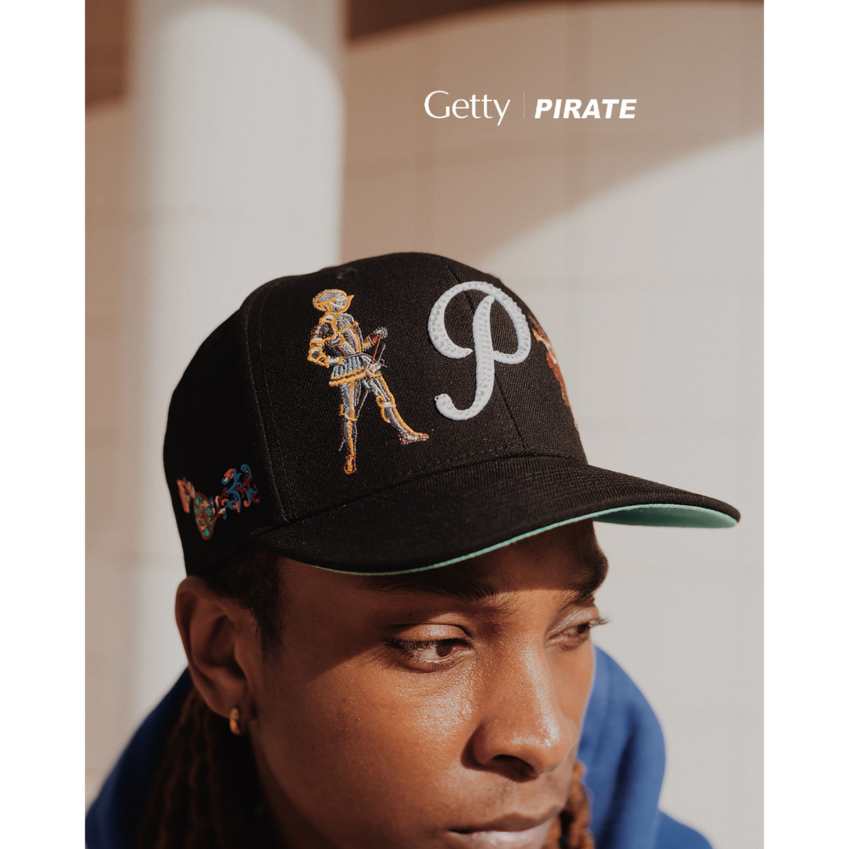 Person wearing a black cap with a skeleton and 'P' design, with 'Getty' and 'PIRATE' text above.