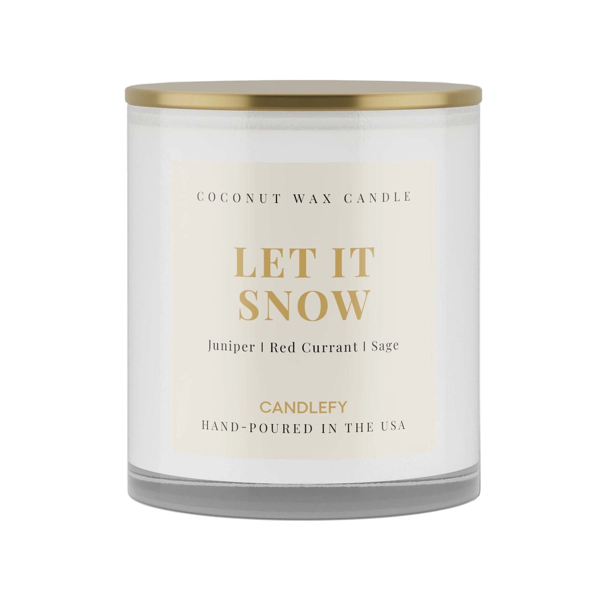 Coconut wax candle labeled 'Let It Snow' with a gold lid on a white background