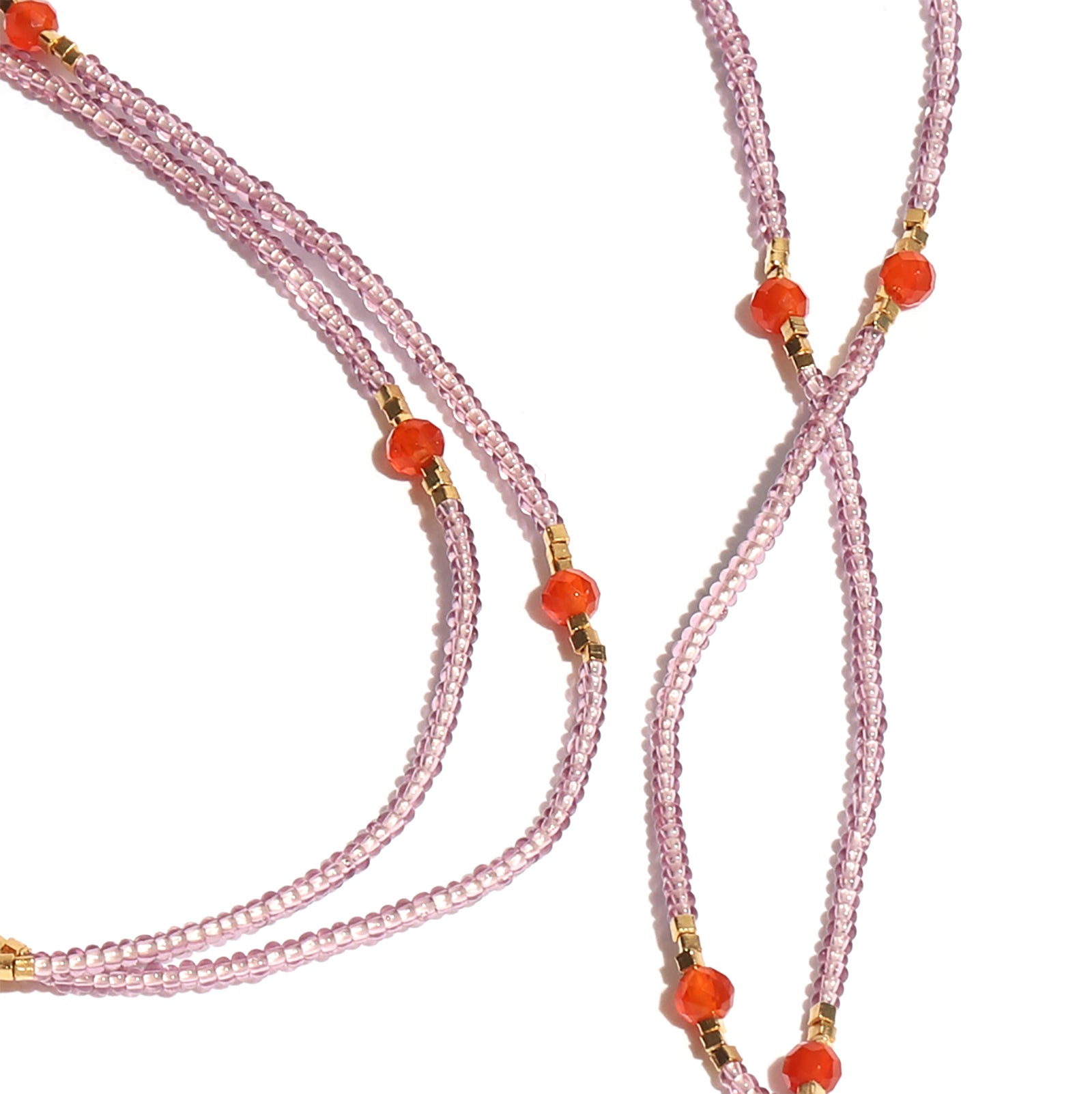 Beaded necklace with pink and orange beads on a white background