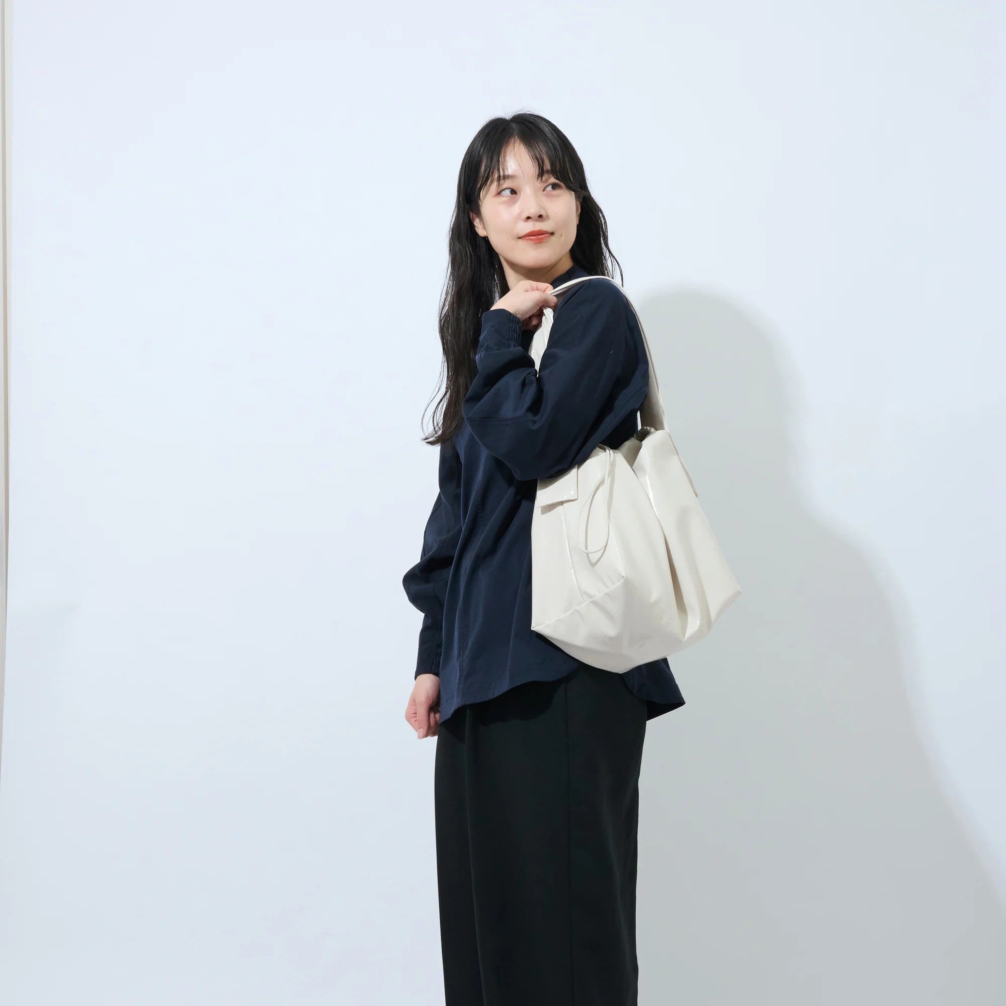 Beige handbag on a white background