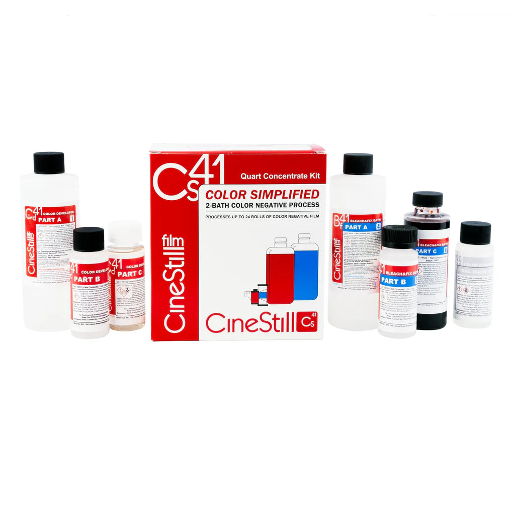 CineStill CS41 film developing kit with various bottles and a box on a white background