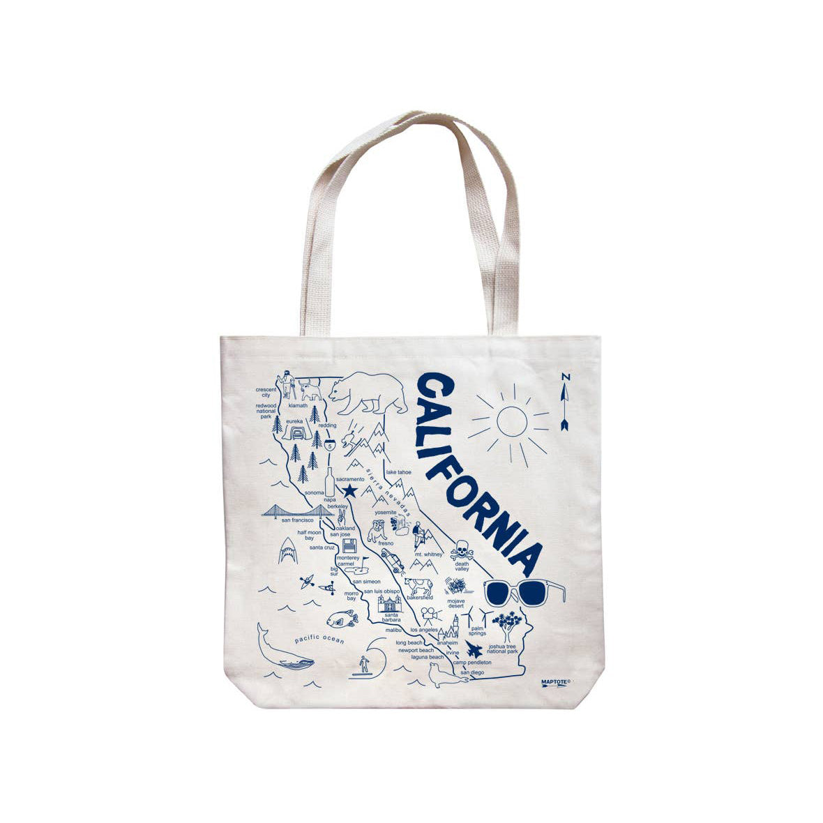 An off-white canvas tote bag featuring a blue line-art map of California with the word 'CALIFORNIA' written vertically, illustrated landmarks, and a sun graphic.