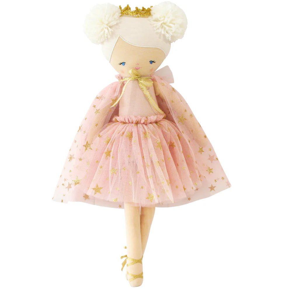 Doll in a pink dress with gold stars and a white headband on a white background
