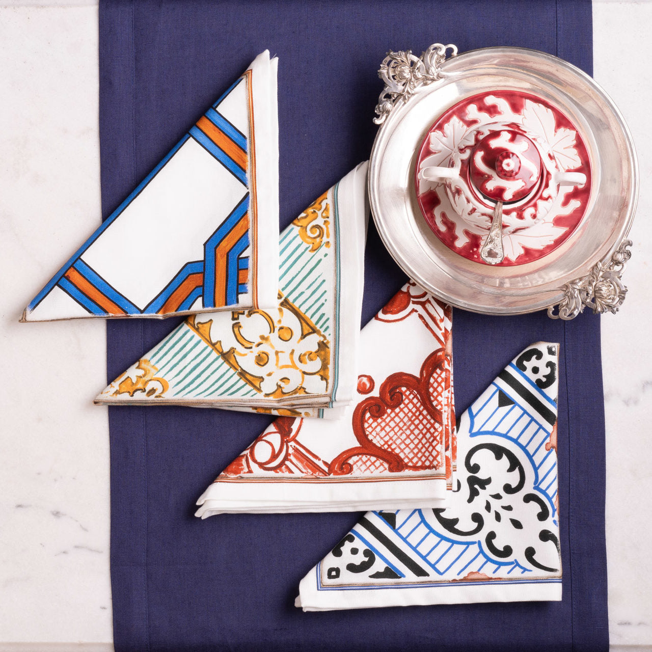 Set of decorative tiles with geometric and floral patterns on a white background