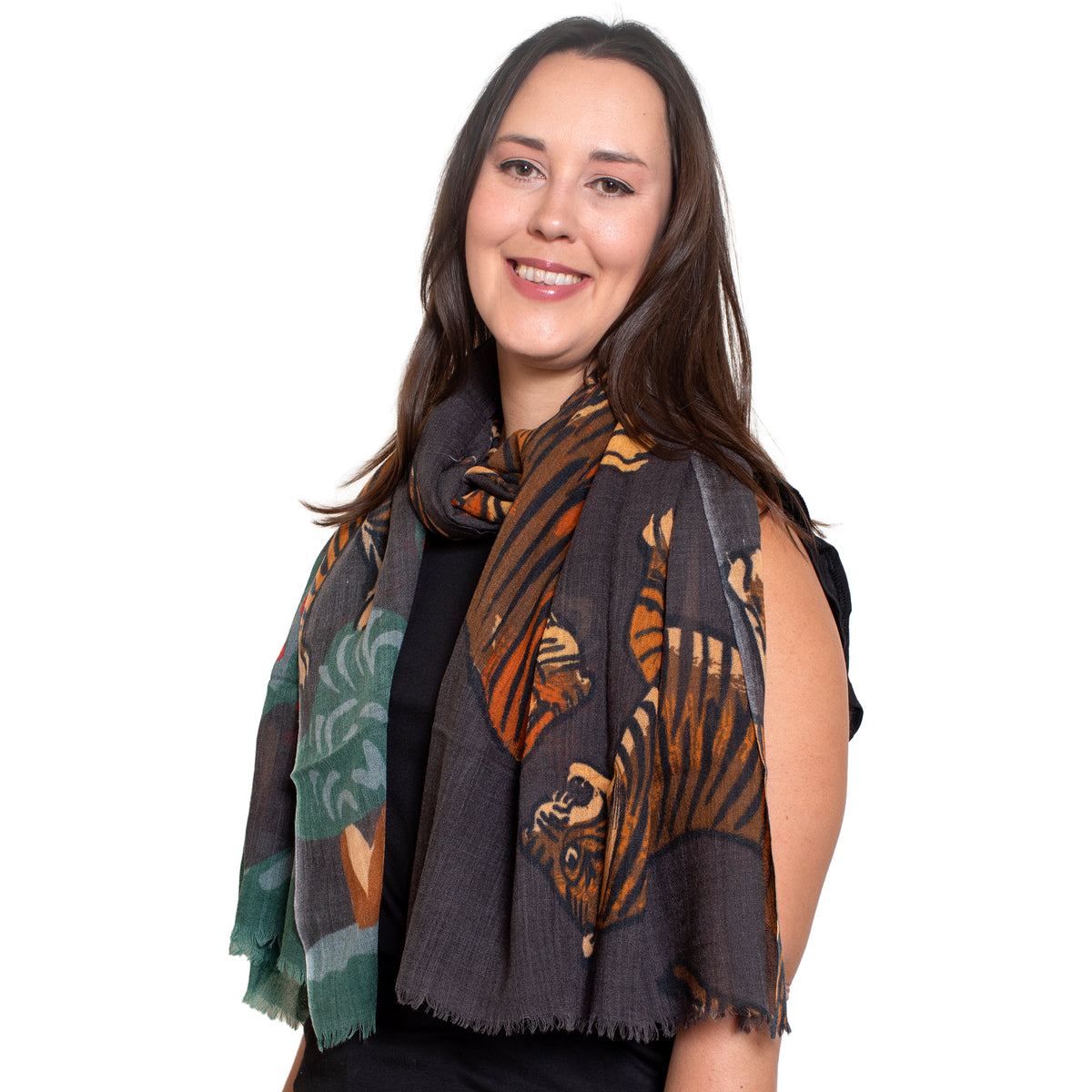 Woman wearing a patterned scarf on a white background