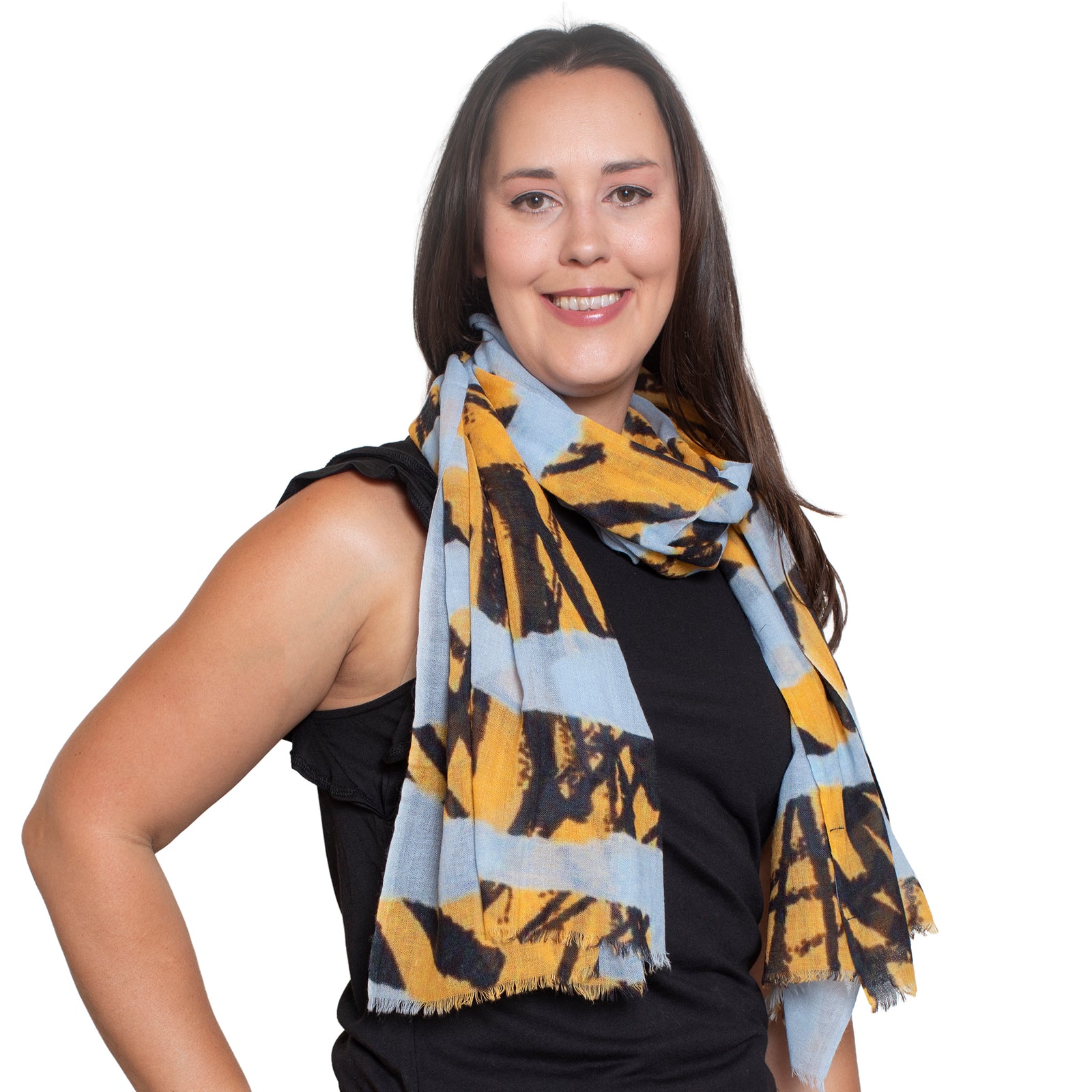 Yellow and black patterned scarf on a white background