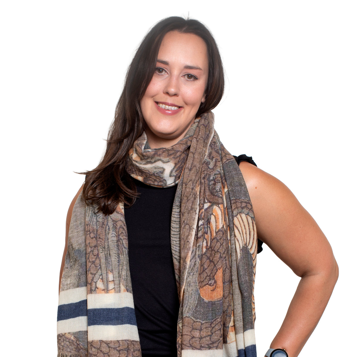 Woman wearing a patterned scarf on a white background