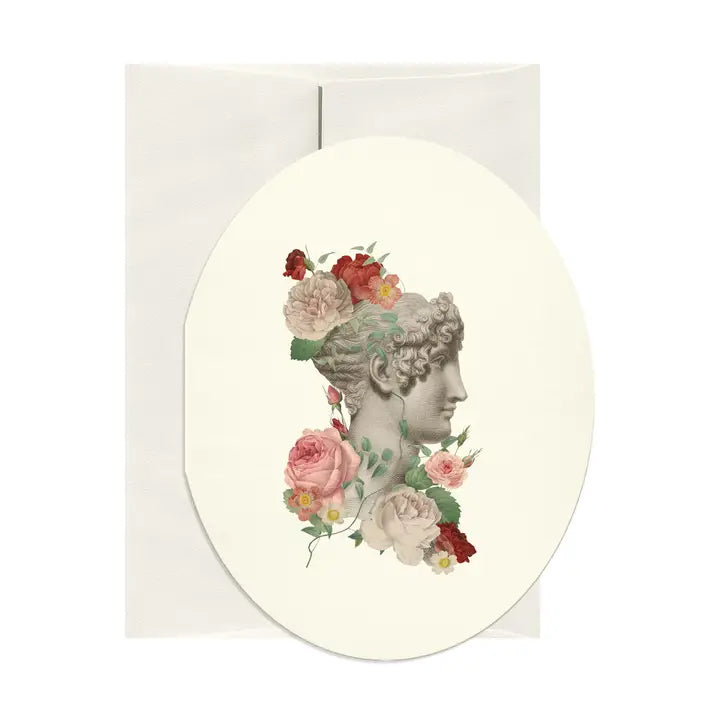 Decorative notecard with classical woman's head and floral wreath on a white background
