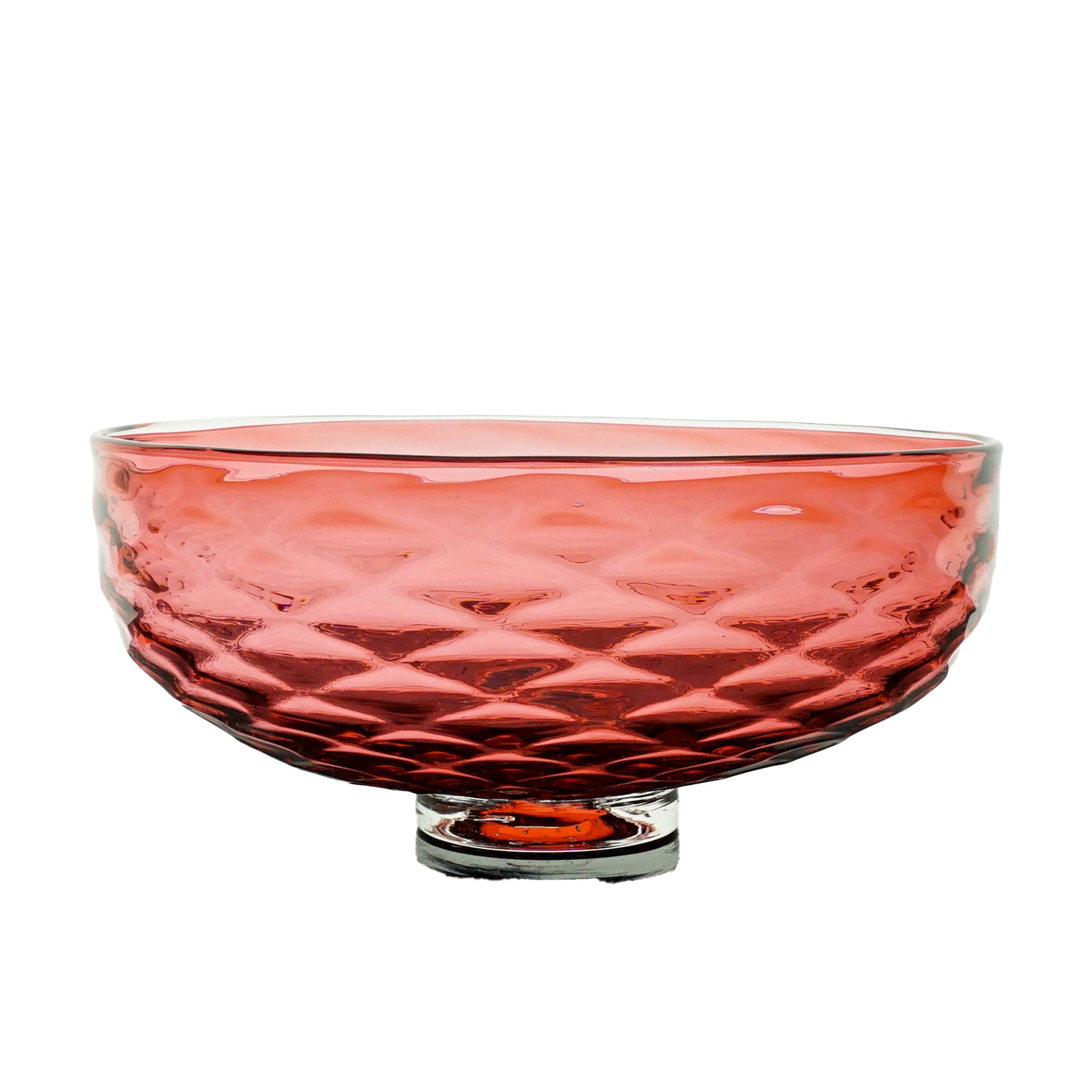 Red glass bowl with textured surface on a white background