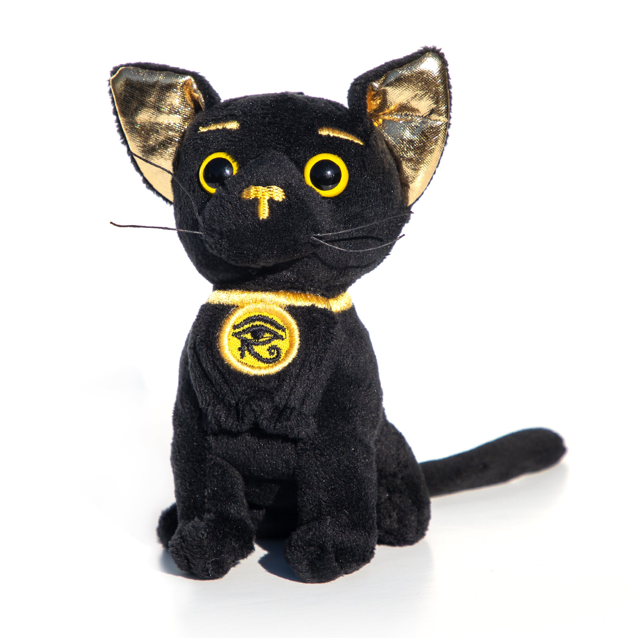 Black cat plush toy with gold accents on a white background