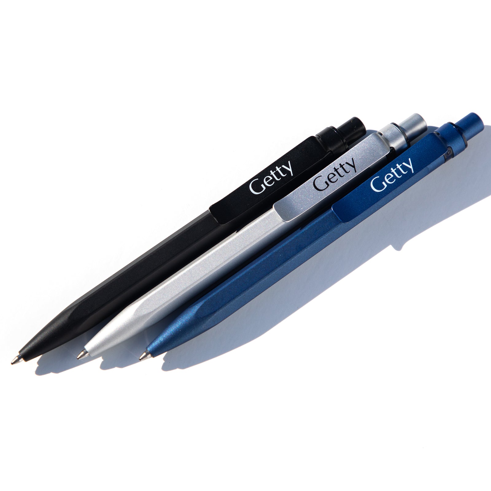 Three pens with 'Getty' branding on a white background