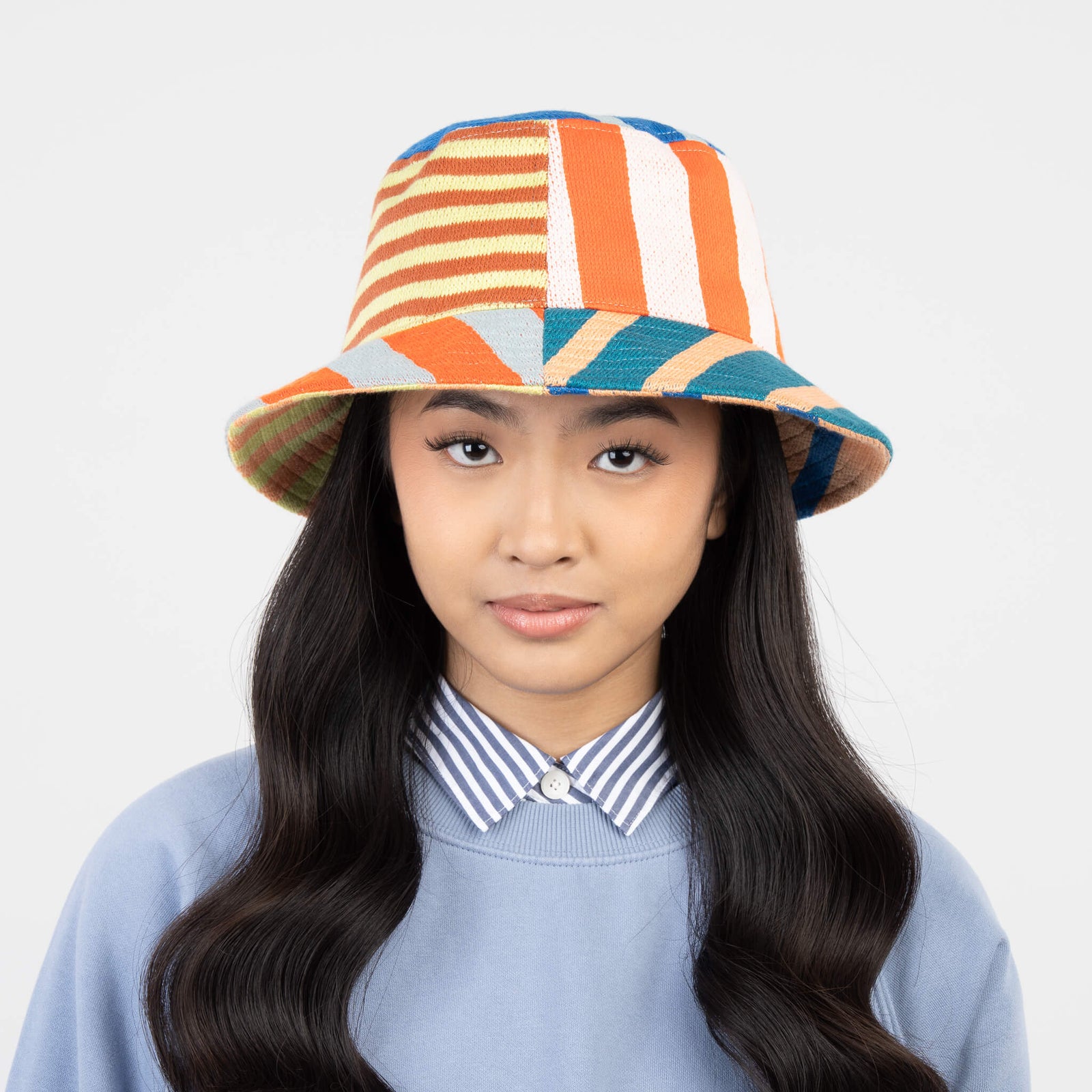 Colorful striped bucket hat on a white background
