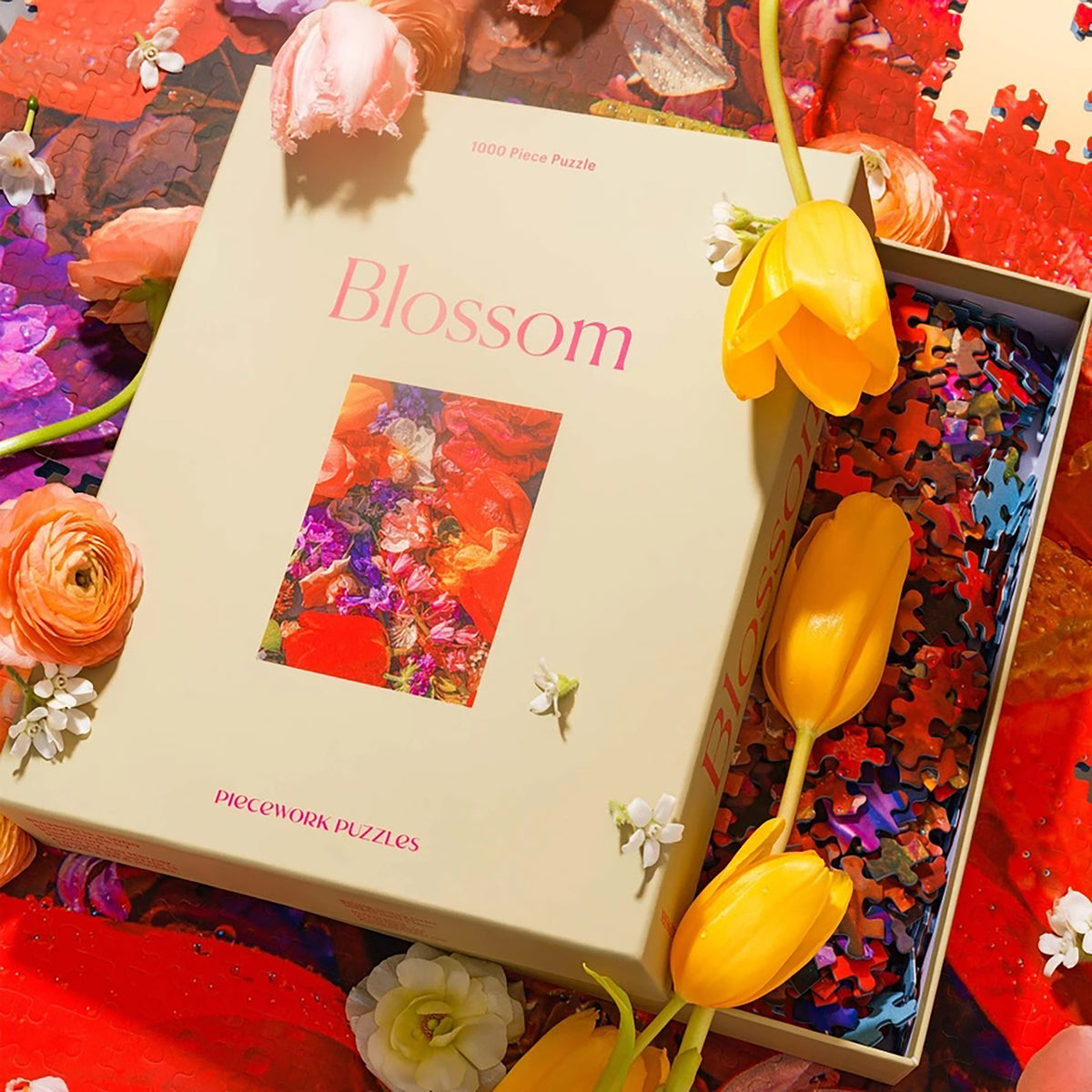 Puzzle box labeled 'Blossom' with flowers and a partially completed puzzle.