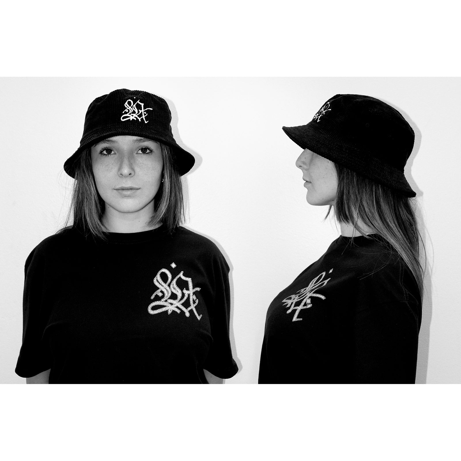 Black bucket hat with white logo on a white background