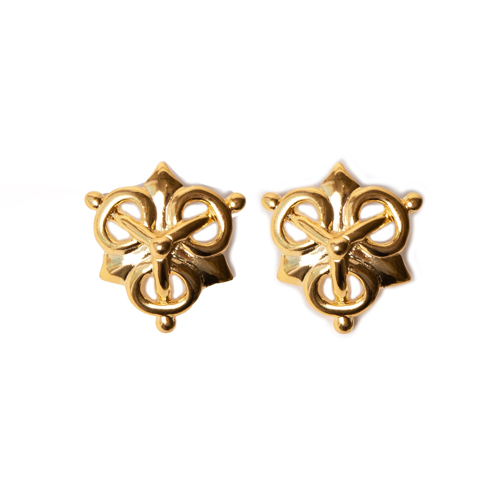Pair of gold earrings with intricate design on a white background