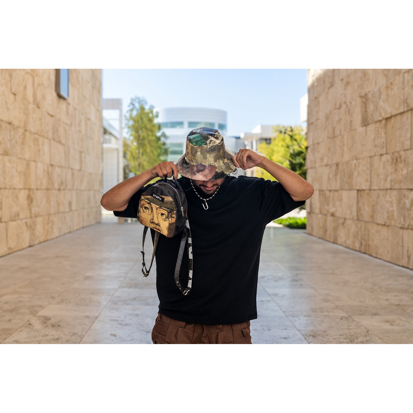 Brown bucket hat with a textured surface on a white background