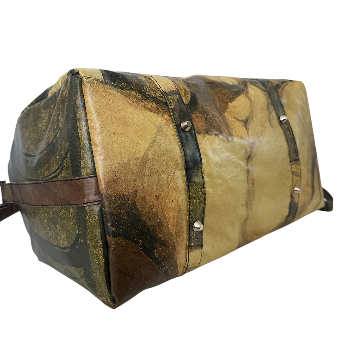 Patterned duffel bag with leather straps on a white background