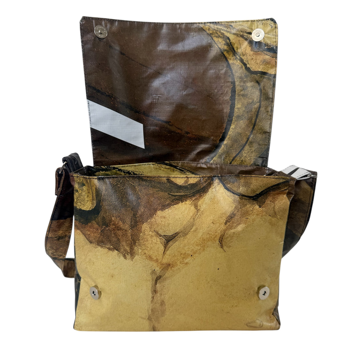 Patterned bag with a flap open on a white background