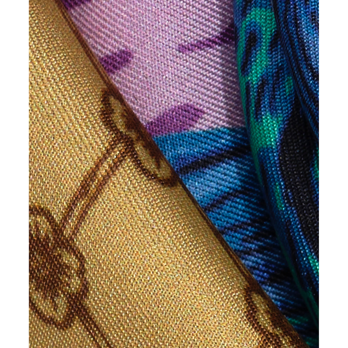 Close-up of fabric with blue, purple, and gold patterns