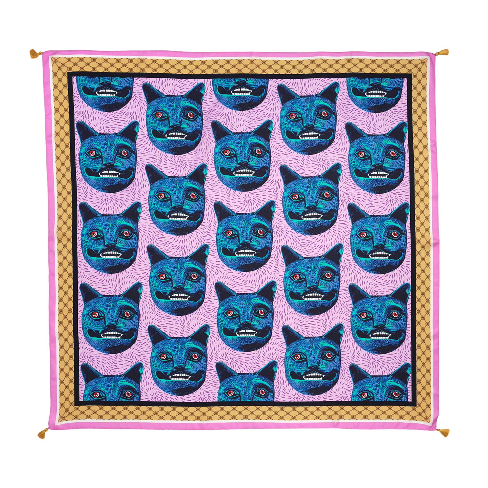 Patterned fabric with blue cat faces on a pink background